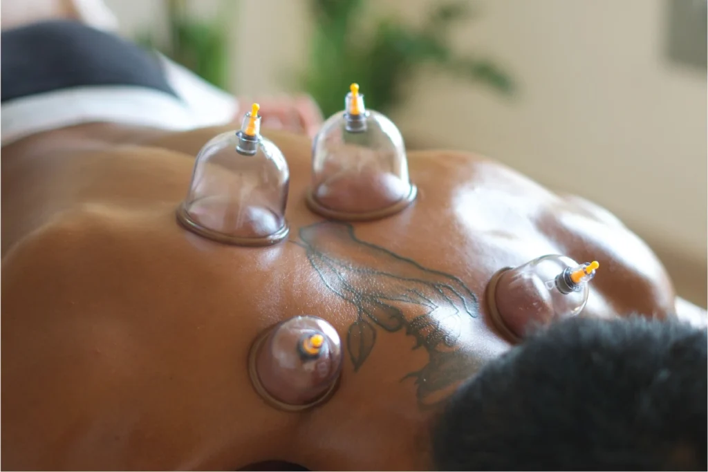 Firm deep tissue pressure applied to a client back during a Barcelona massage